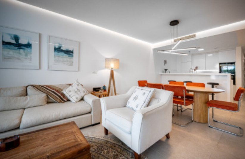 Living and dining area with modern lighting